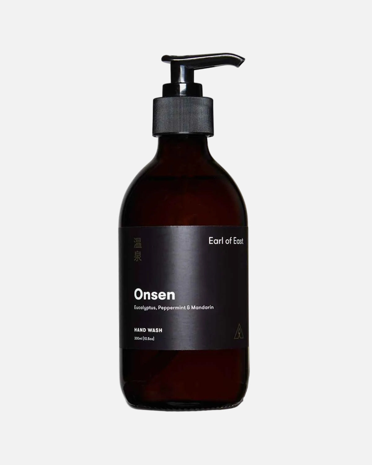 A dark amber glass pump bottle of Onsen hand wash with a black label and black pump dispenser, set against a plain white background.