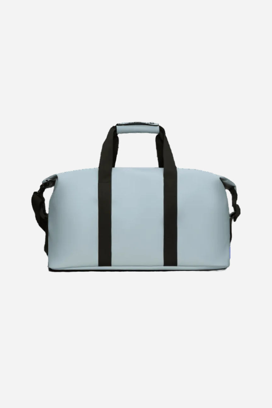 Light blue weekend bag with black straps on a white background