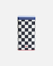 A rectangular metal tin with a black and white checkerboard pattern, a blue top lid, and a small red logo near the bottom, set against a plain white background.