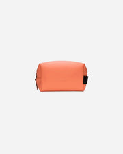 Orange toiletry bag on a white background
