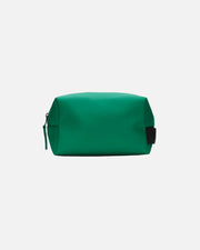 A green zippered cosmetic pouch with a small black side tab, photographed on a plain white background.