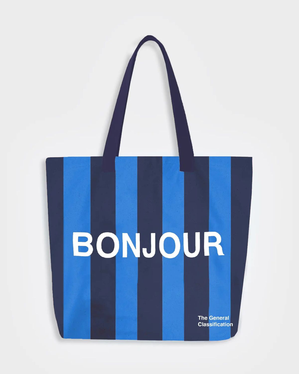 Navy and blue striped tote bag with 'Bonjour' text on a white background