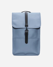 Blue backpack with a black strap on a white background