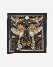 Decorative pillow with bird and floral design on a black background