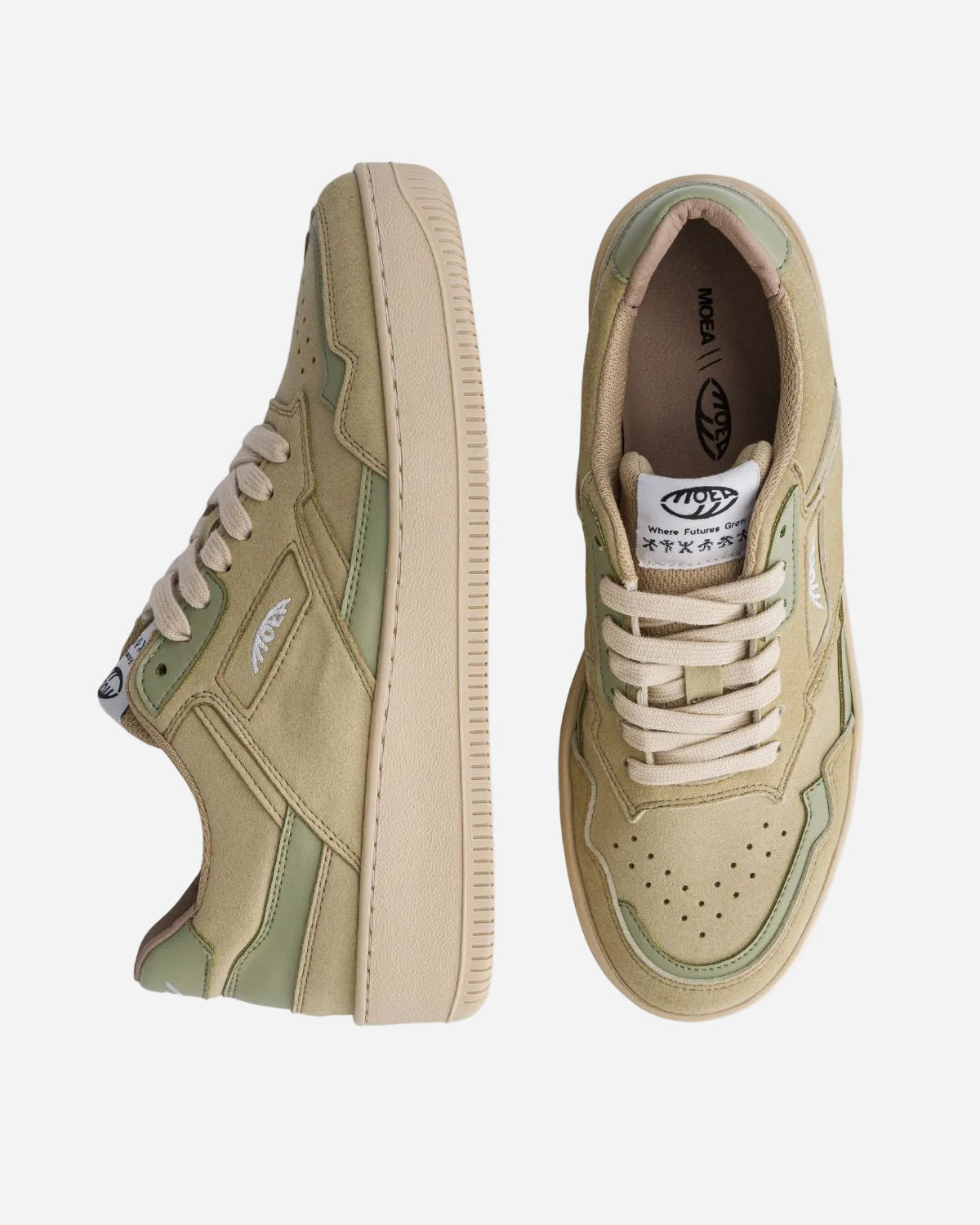Pair of beige sneakers with green accents on a white background
