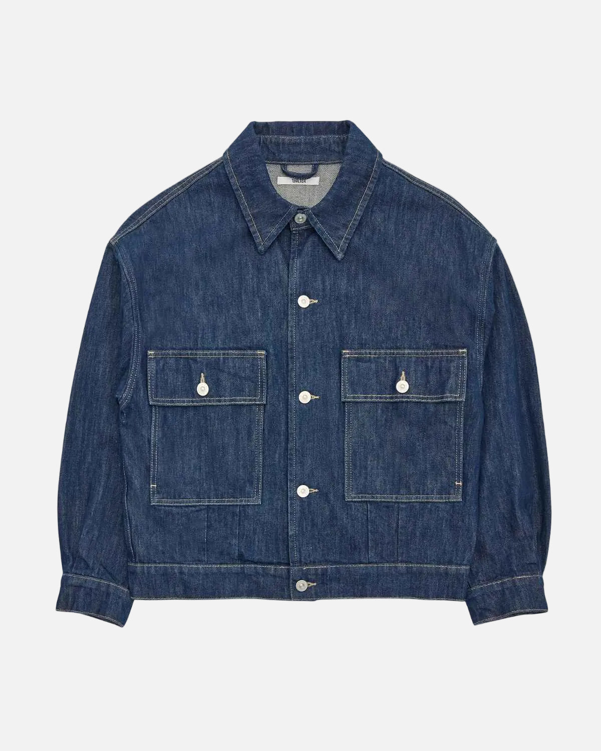 A dark blue denim jacket with two buttoned chest pockets, displayed flat against a solid white background.