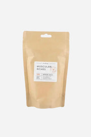 Kraft paper packaging with a label for 'Muscular Aches' on a white background