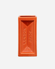 Orange brick-shaped container with 'London Brick' branding on a white background