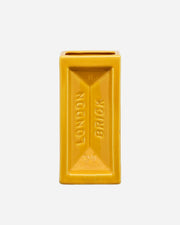 Yellow rectangular vase with 'London Brick' text on a white background