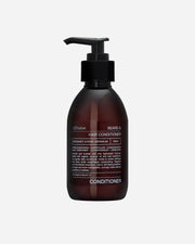 Brown hair conditioner bottle with pump on a white background