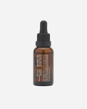 Brown glass bottle with black cap on a white background