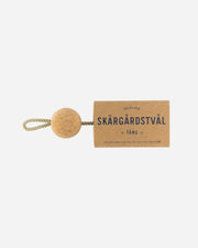 Cork ball with a rope and a cardboard tag labeled 'Skärgärdstvål' on a white background
