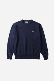 Navy blue sweatshirt with a small logo on a light gray background