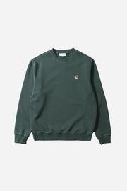 Green sweatshirt with a small logo on a light gray background