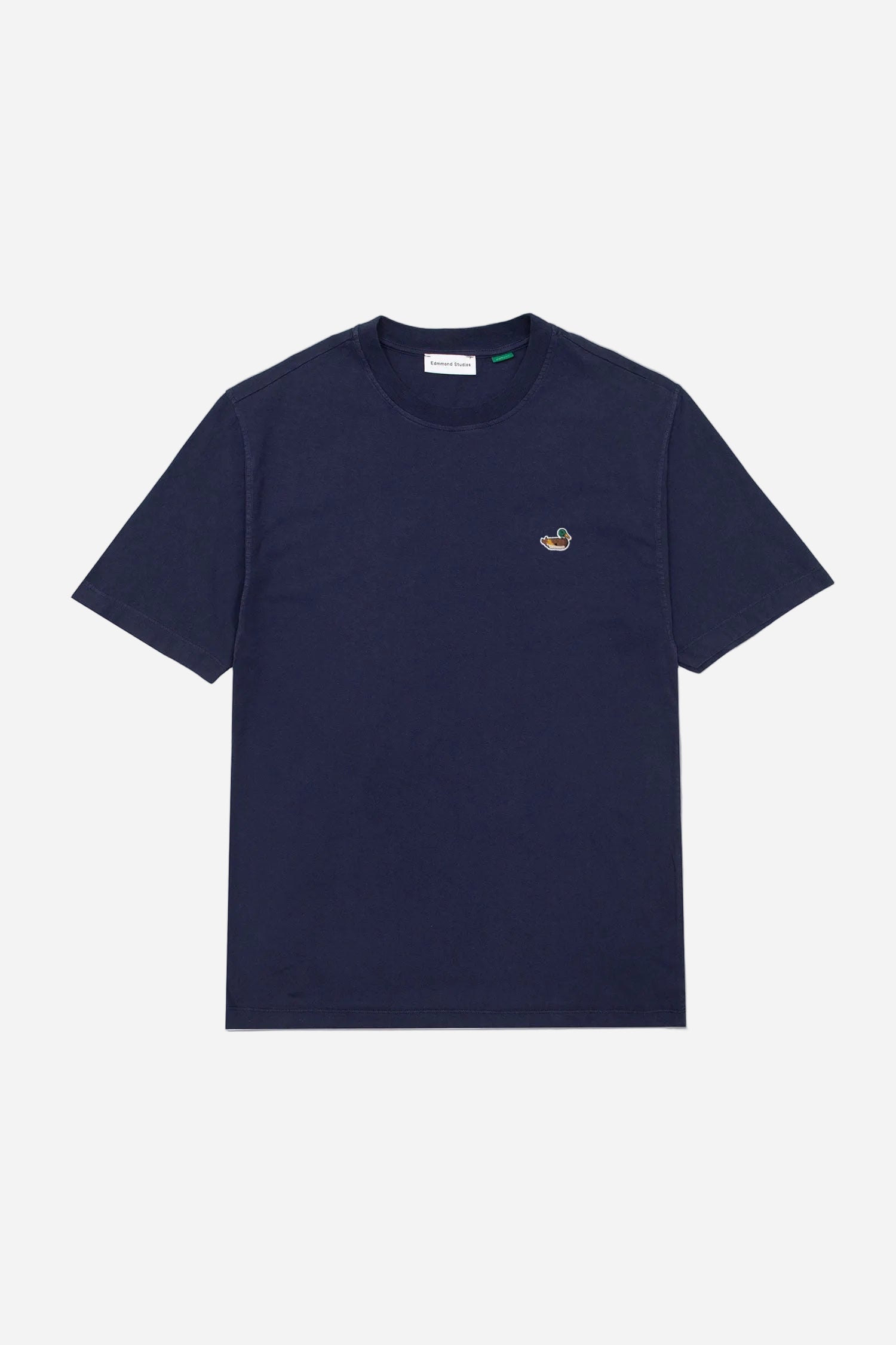 Navy blue t-shirt with a small logo on a light gray background