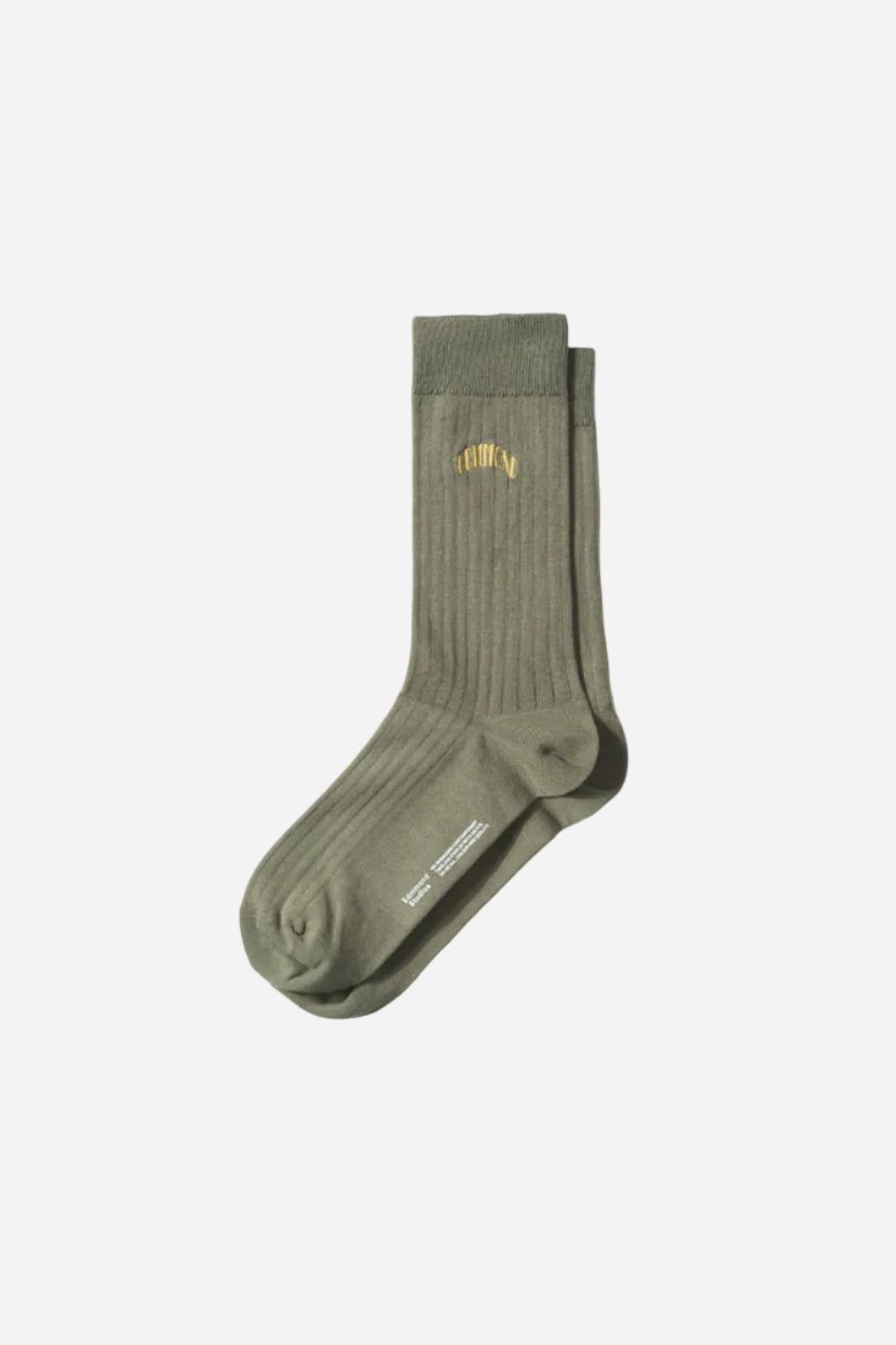 Green sock with a brand logo on a white background