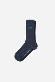 Navy sock with a green logo on a white background