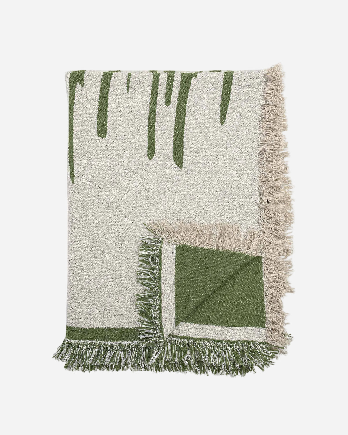 Green and beige woven blanket with fringes on a white background