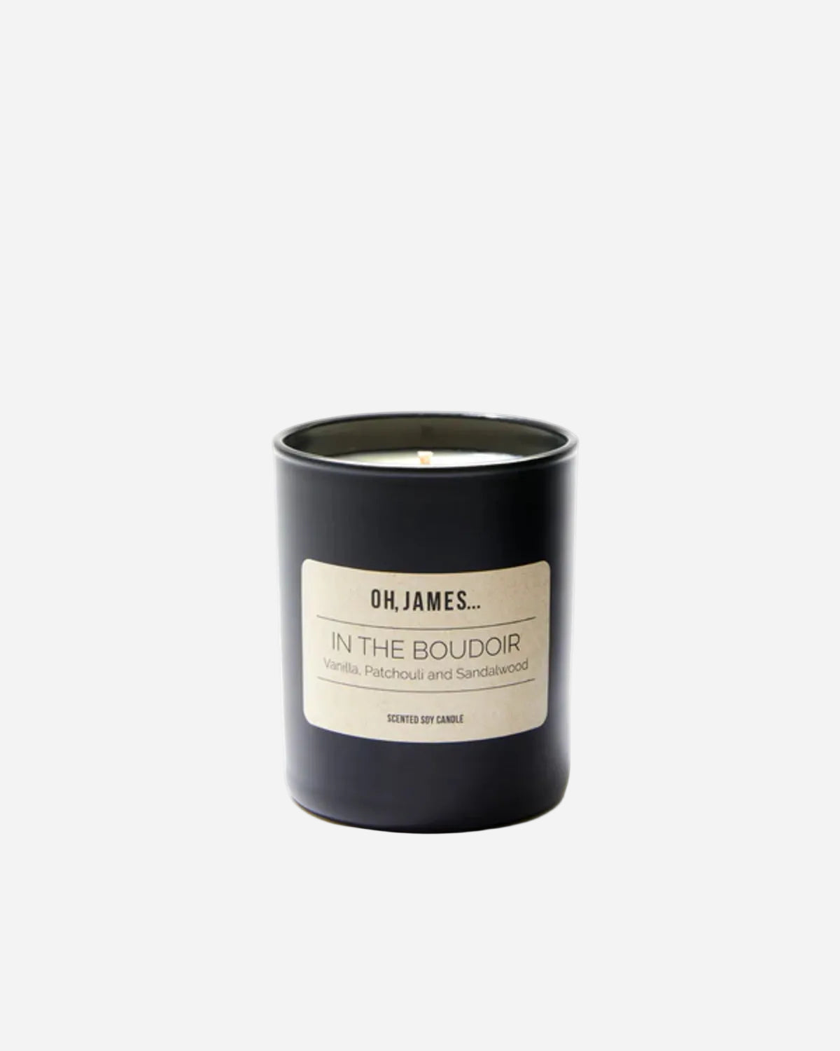 Black candle with a label on a white background