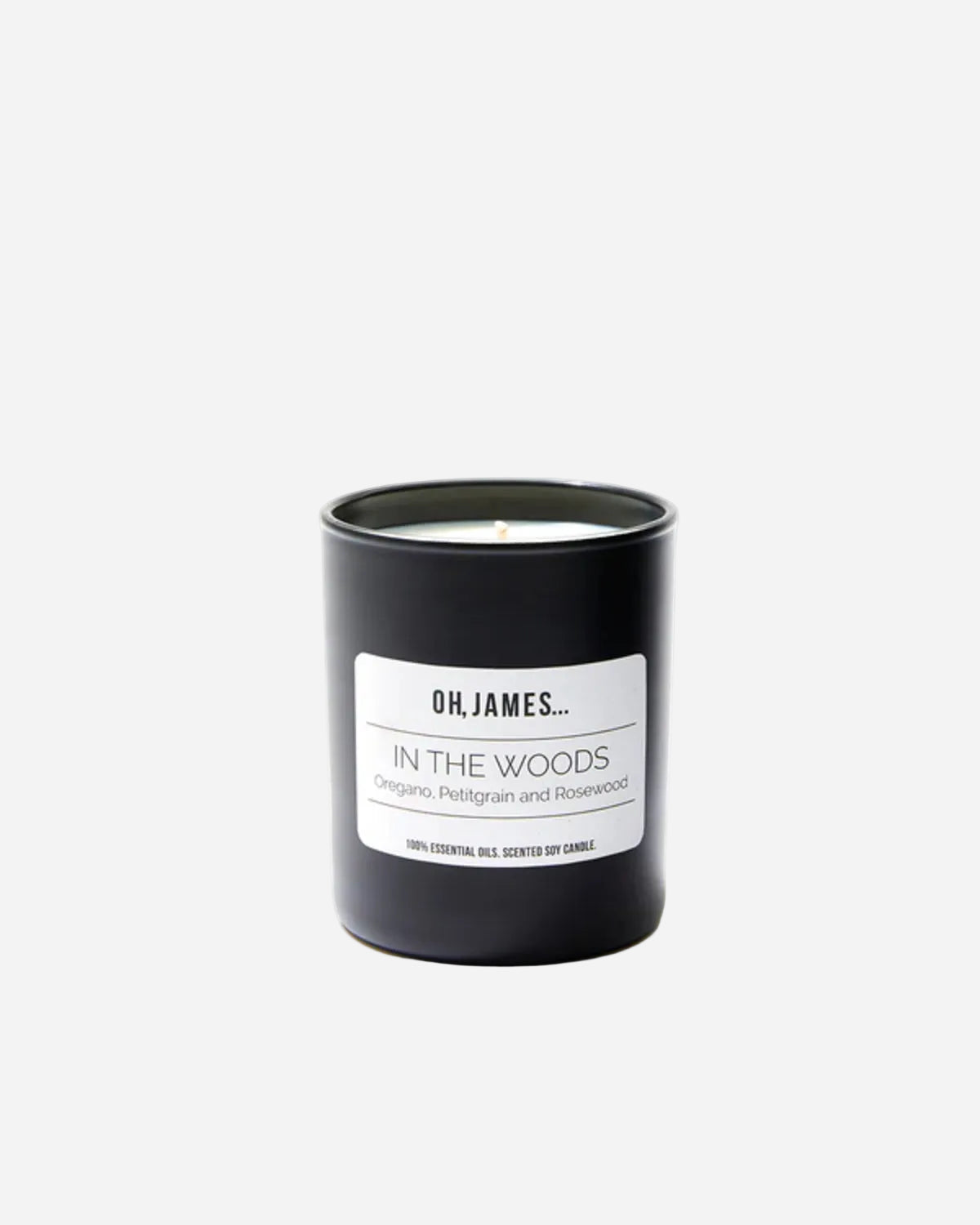 Candle with 'OH, JAMES' label on a white background
