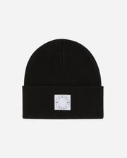 Black beanie with a white logo patch on a white background