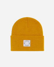 Yellow beanie with a white label on a white background