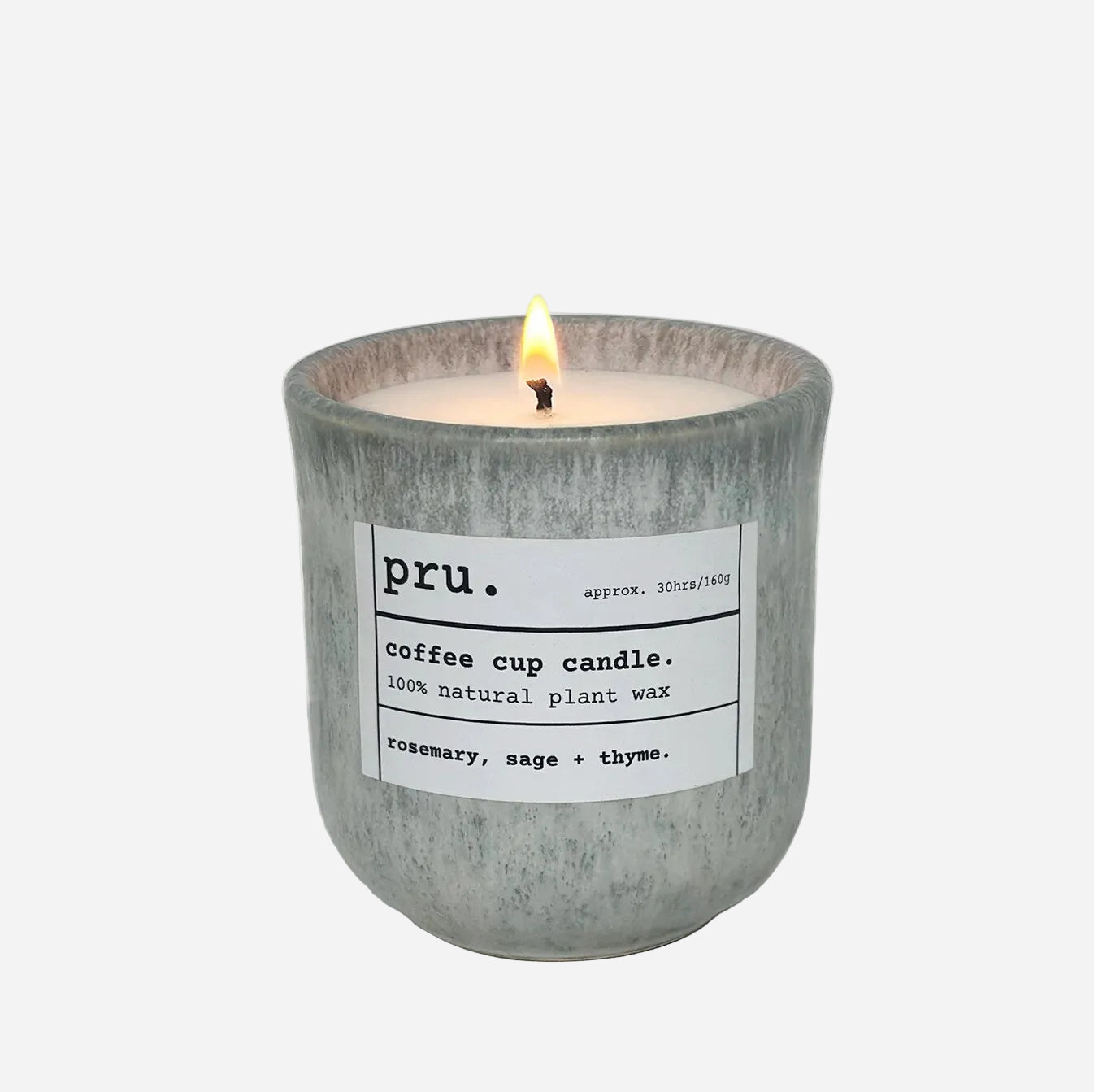 Candle in a gray container with a label on a white background
