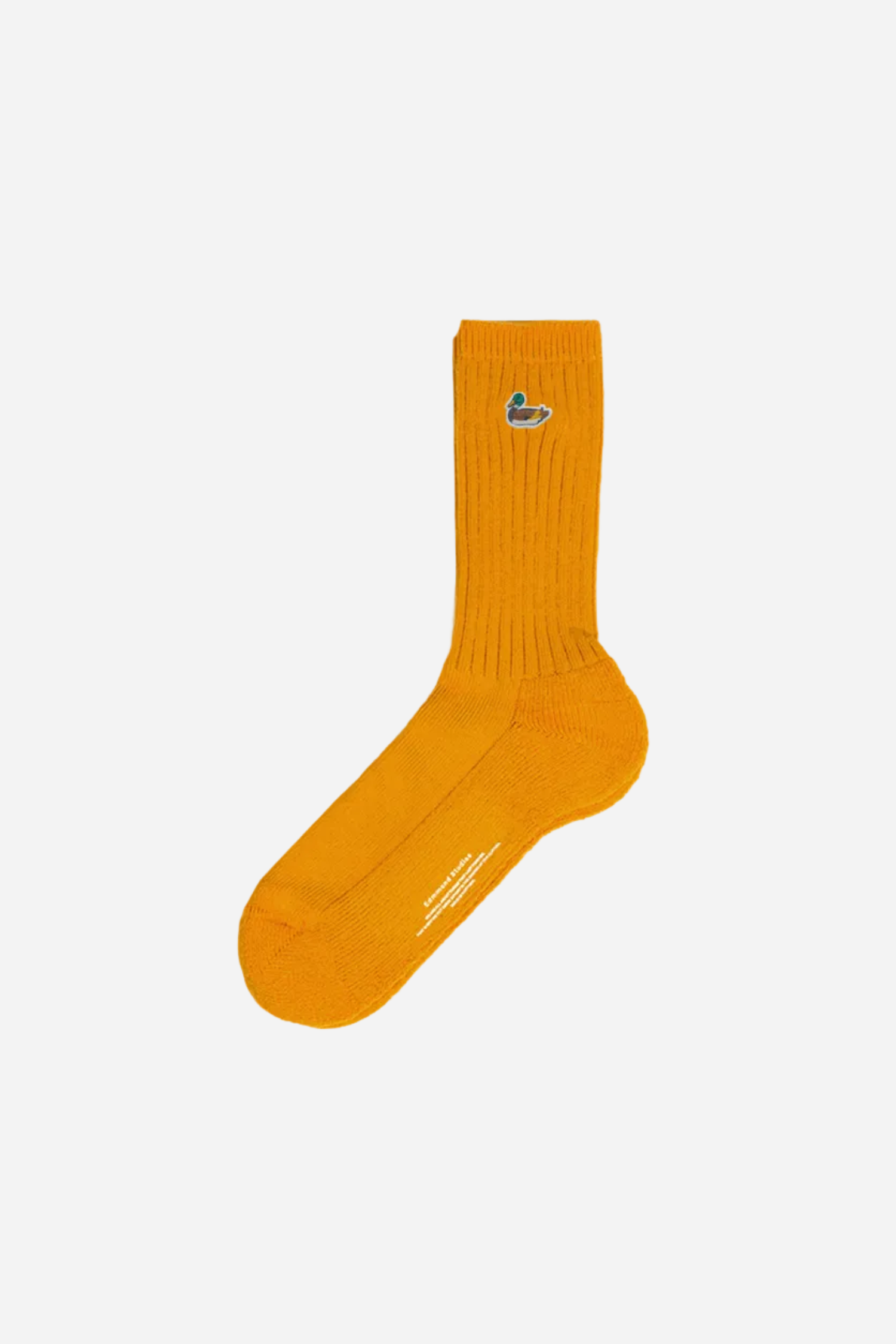 Yellow sock with a brand logo on a white background