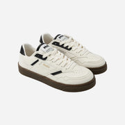 White sneakers with black accents on a white background