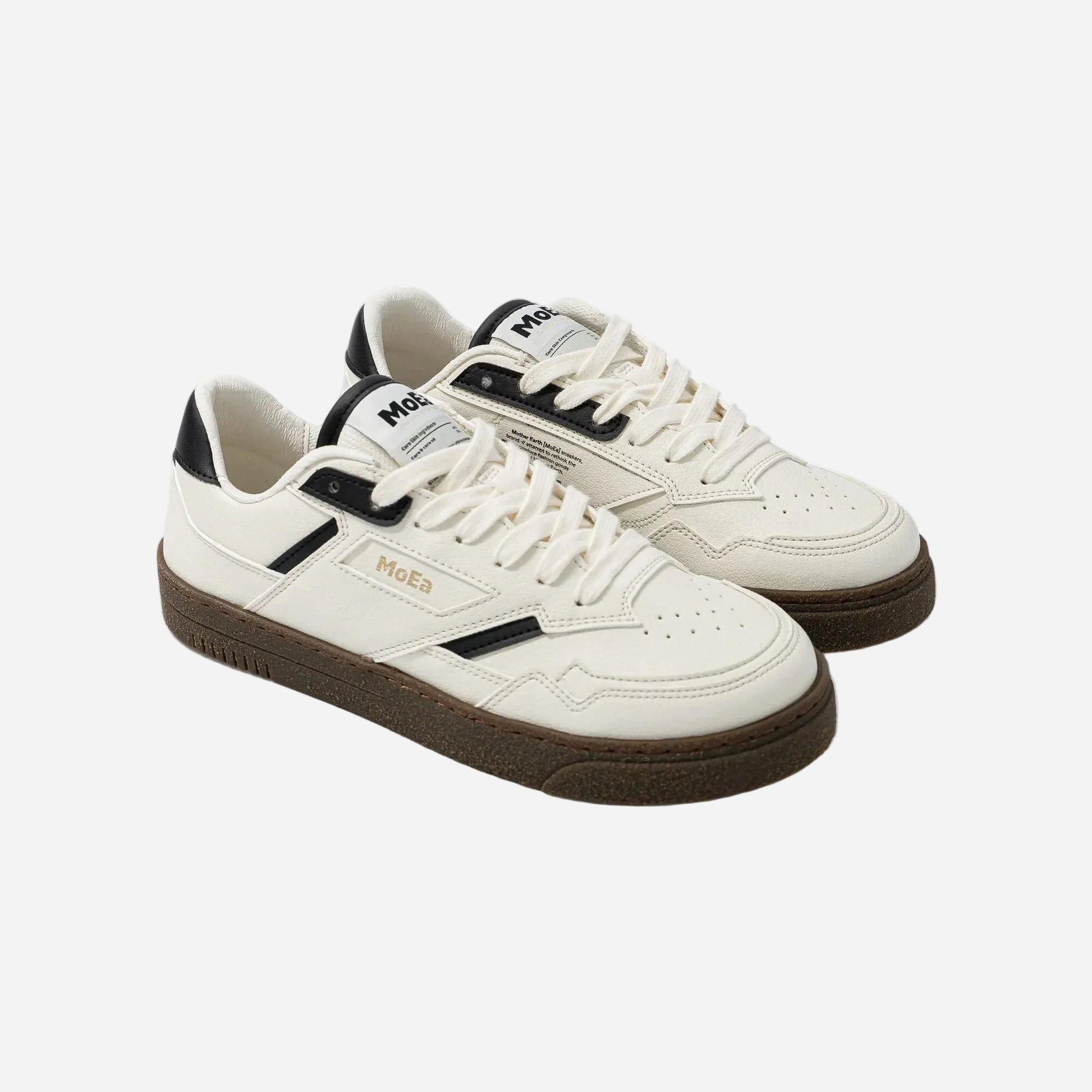 White sneakers with black accents on a white background