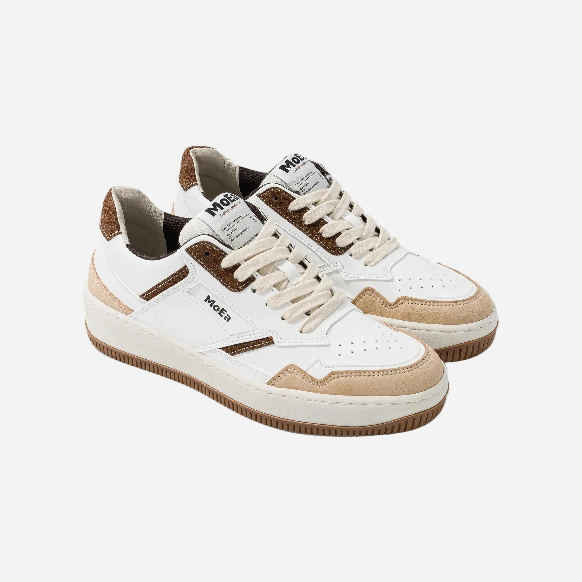 White sneakers with brown accents on a white background