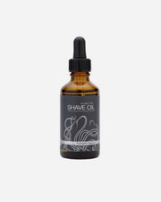 Bottle of shave oil with dropper on a white background