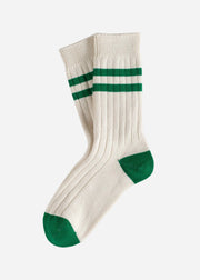 White socks with green stripes and cuffs on a white background