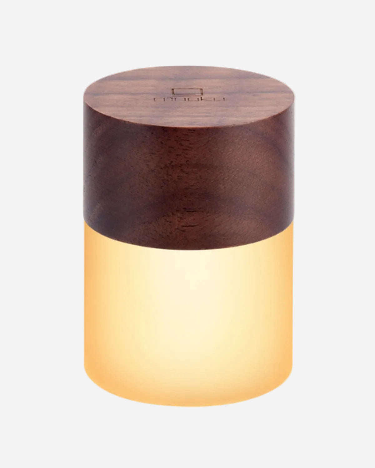 Wooden cylindrical lamp with a warm glow on a white background