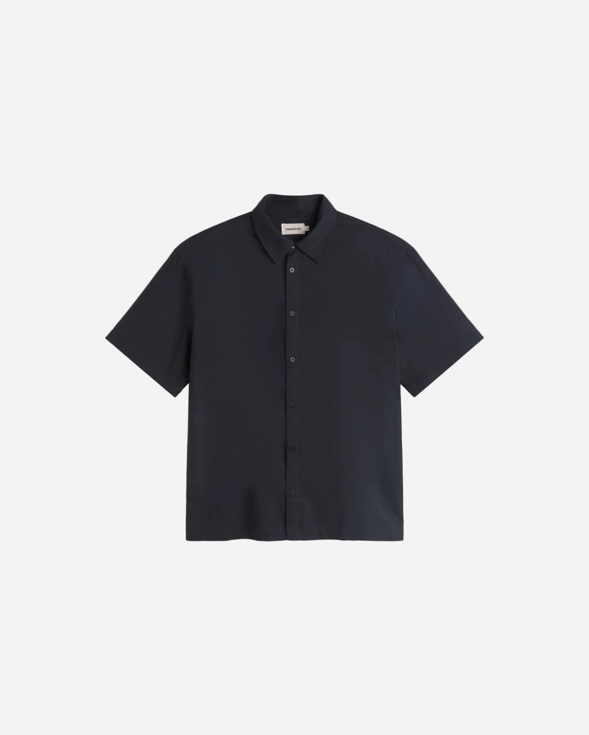 Navy short-sleeve shirt on a light gray background