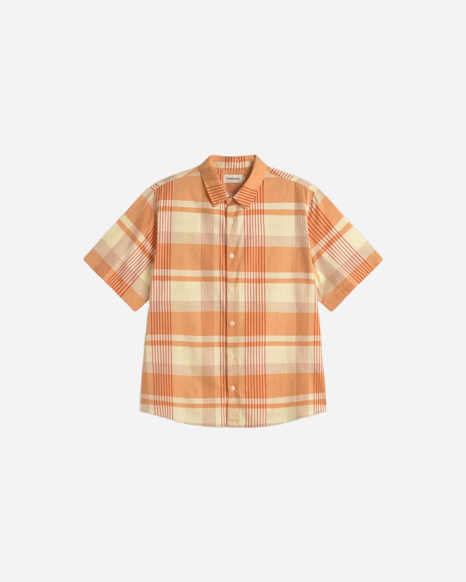 Plaid shirt with short sleeves on a light beige background