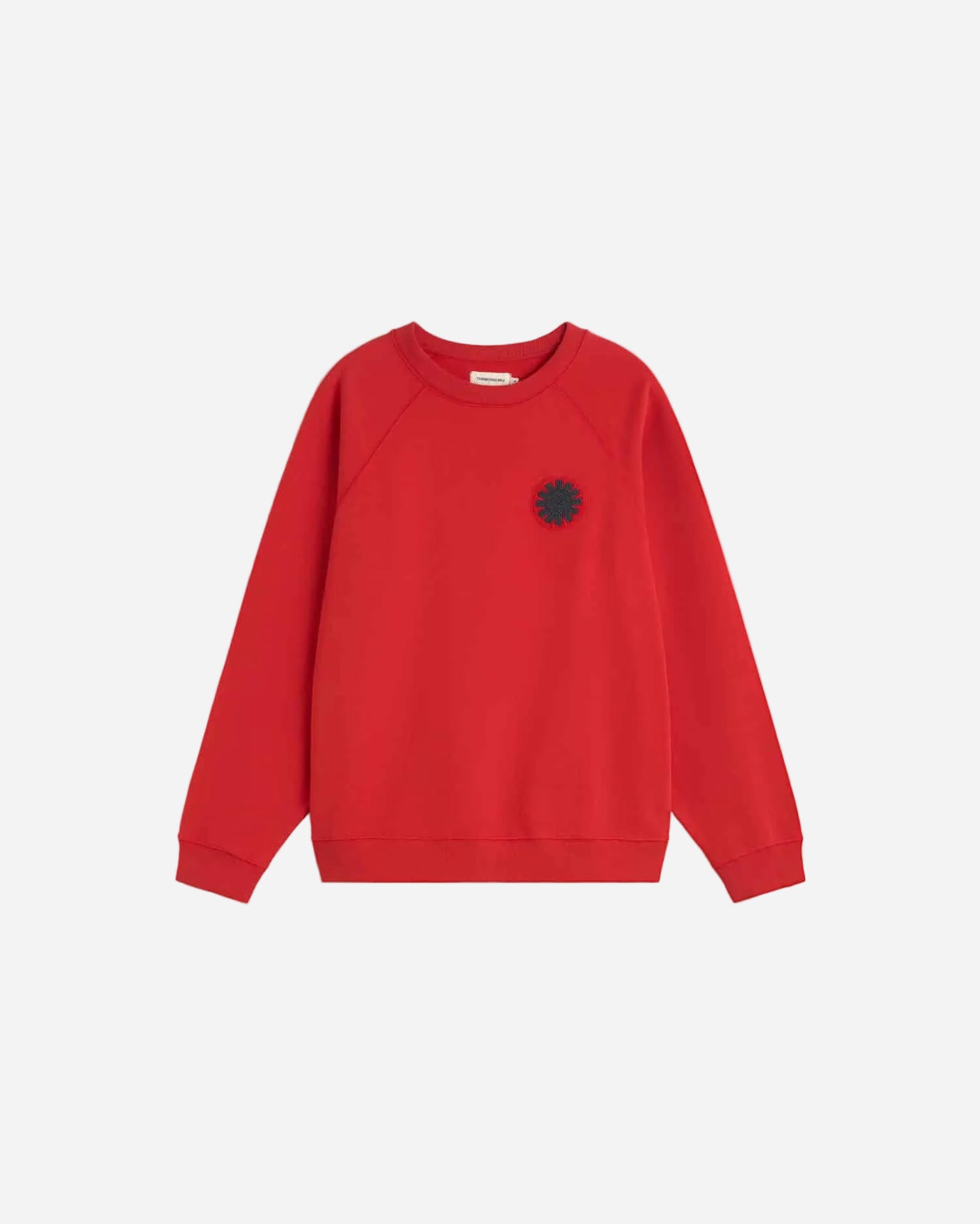 Red sweatshirt with a black flower design on a light gray background