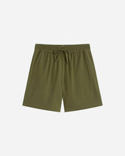 Green shorts on a light gray background