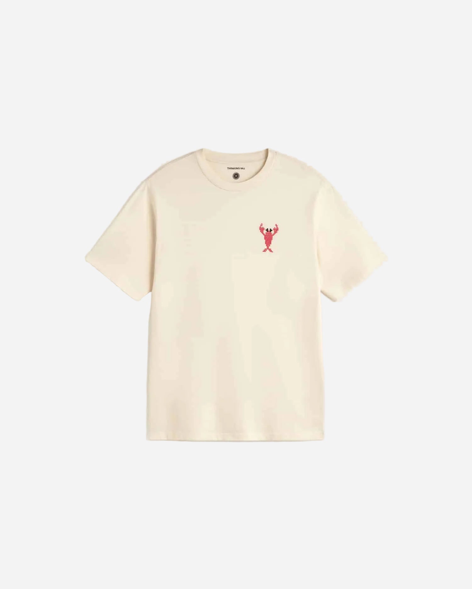 Beige t-shirt with a small red  emrboidered lobster on a light gray background