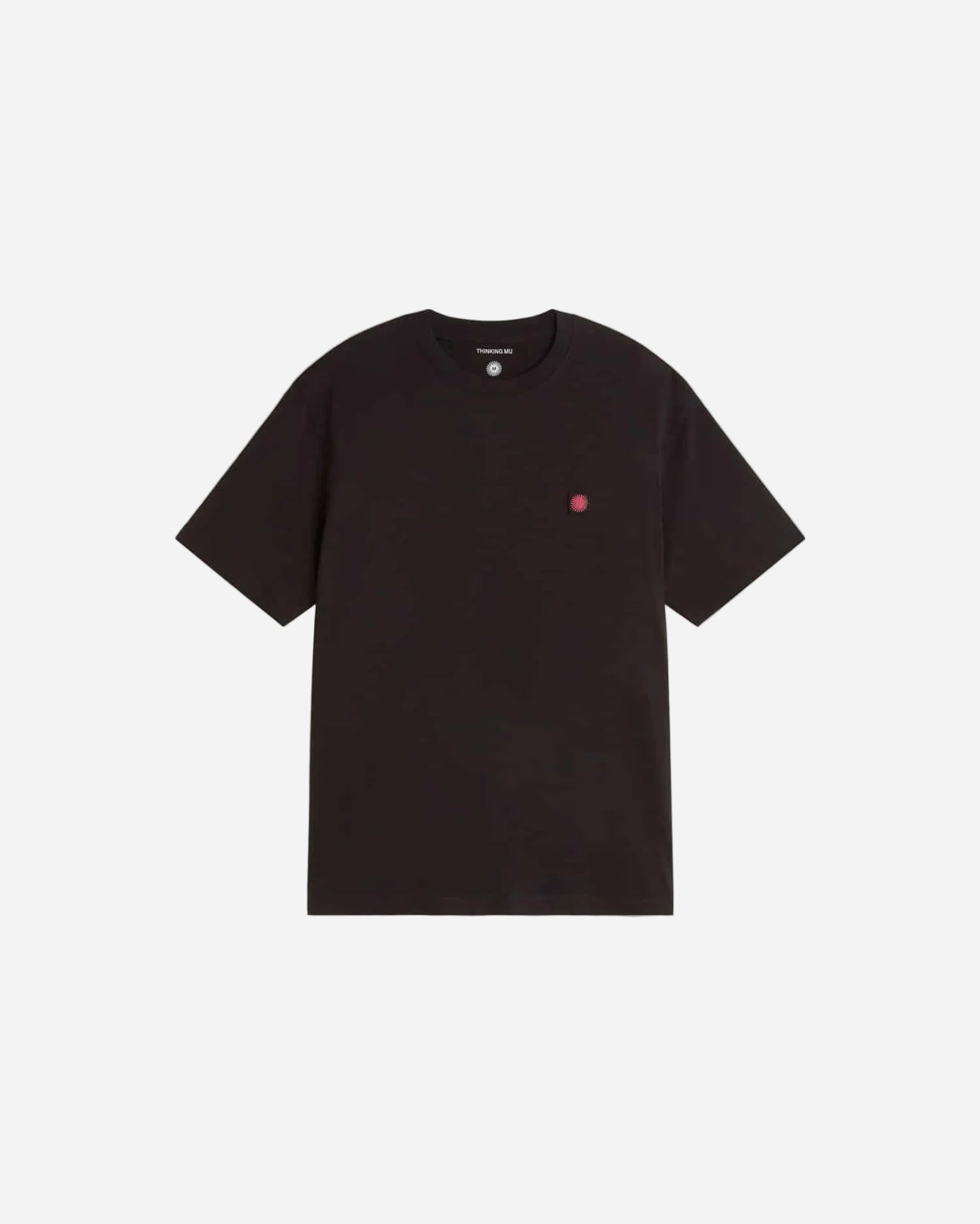 Black t-shirt with a small red logo on a light gray background